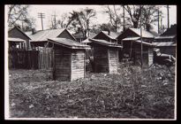 Row of shacks. Black and white photo. 